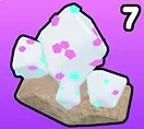 White Opal crystals with pink and cyan flecks on a tan base.